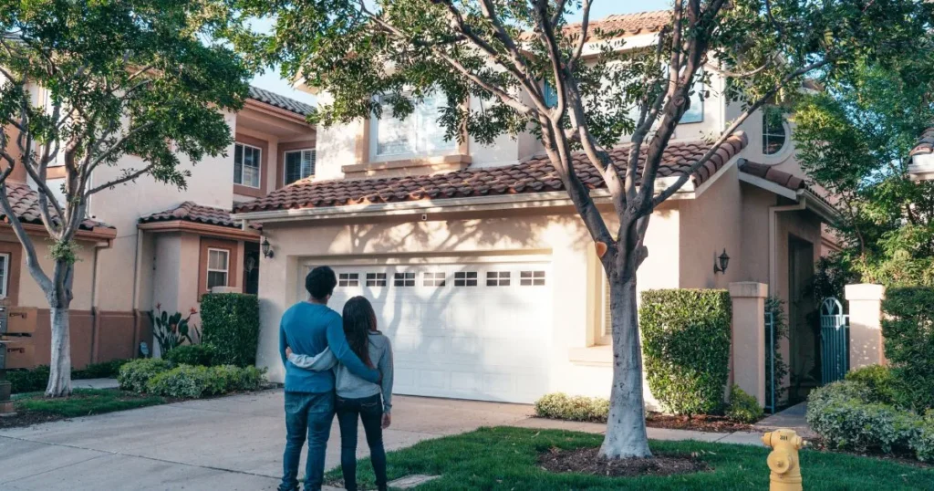 A married couple admiring the home they just purchased.