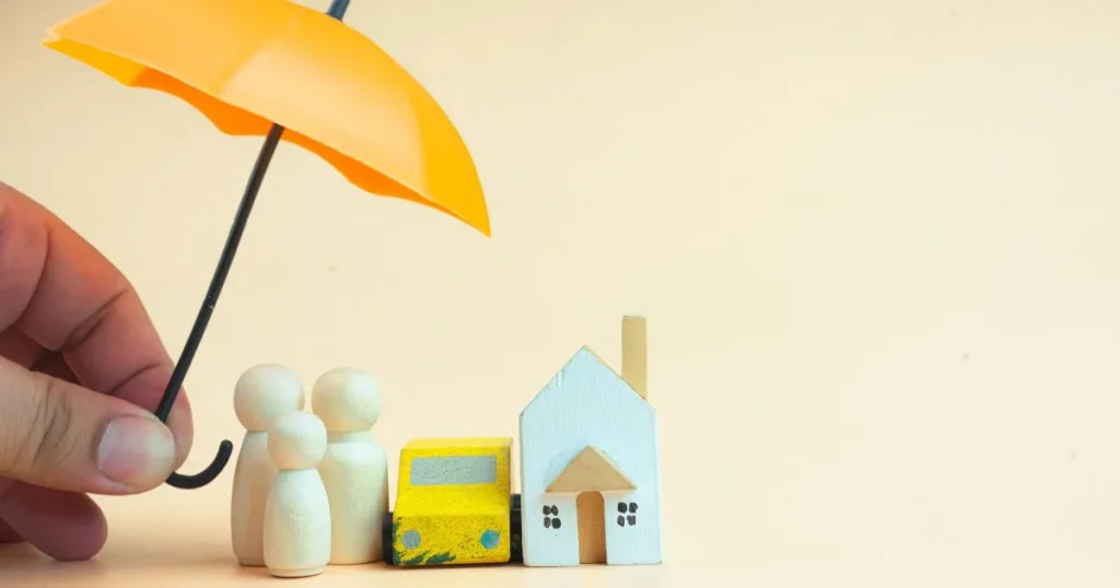 an umbrella, symbolizing insuramce, covering a family.